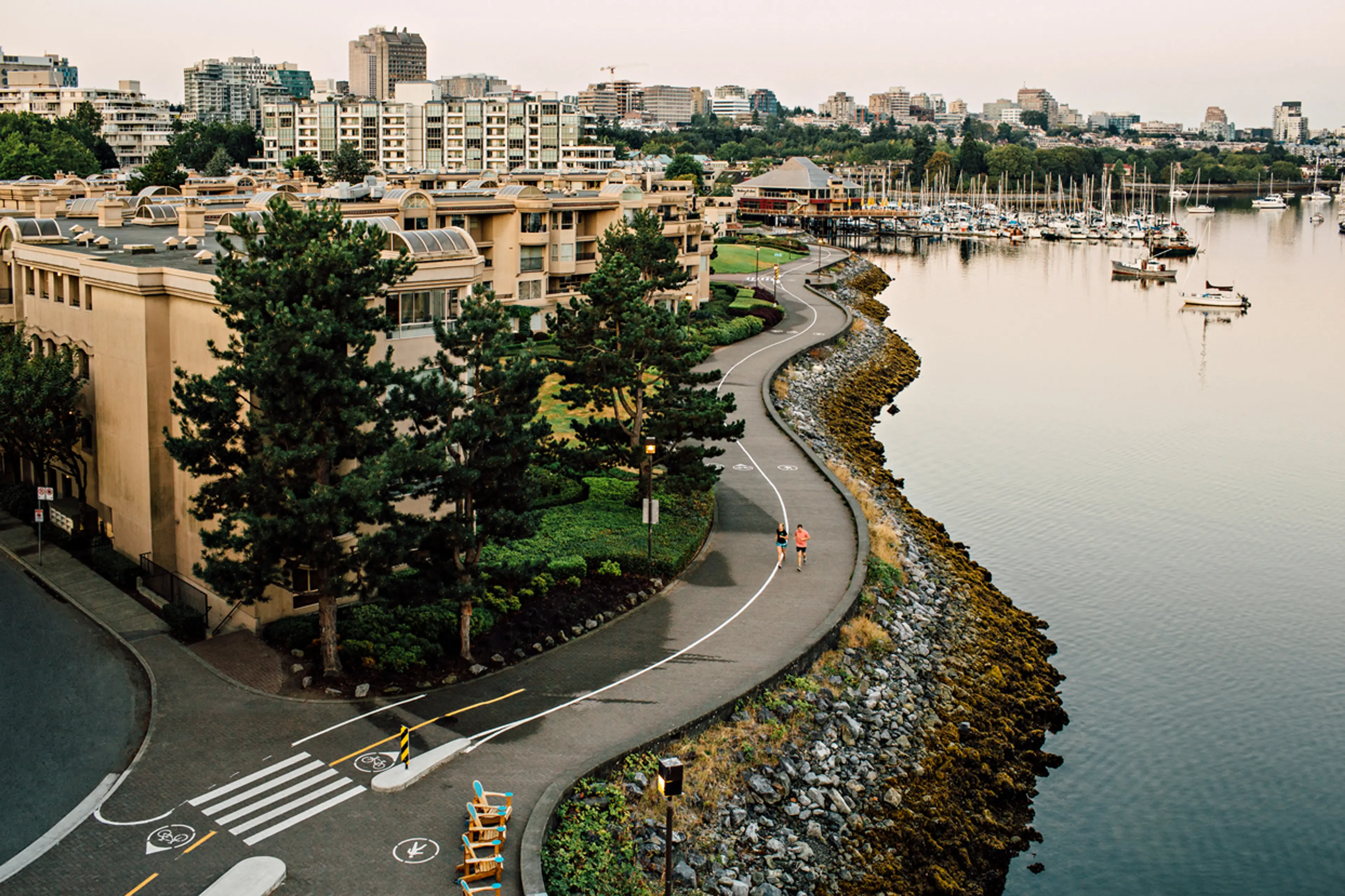 People on the False Creek Seawall near the Cambie Street Bridge