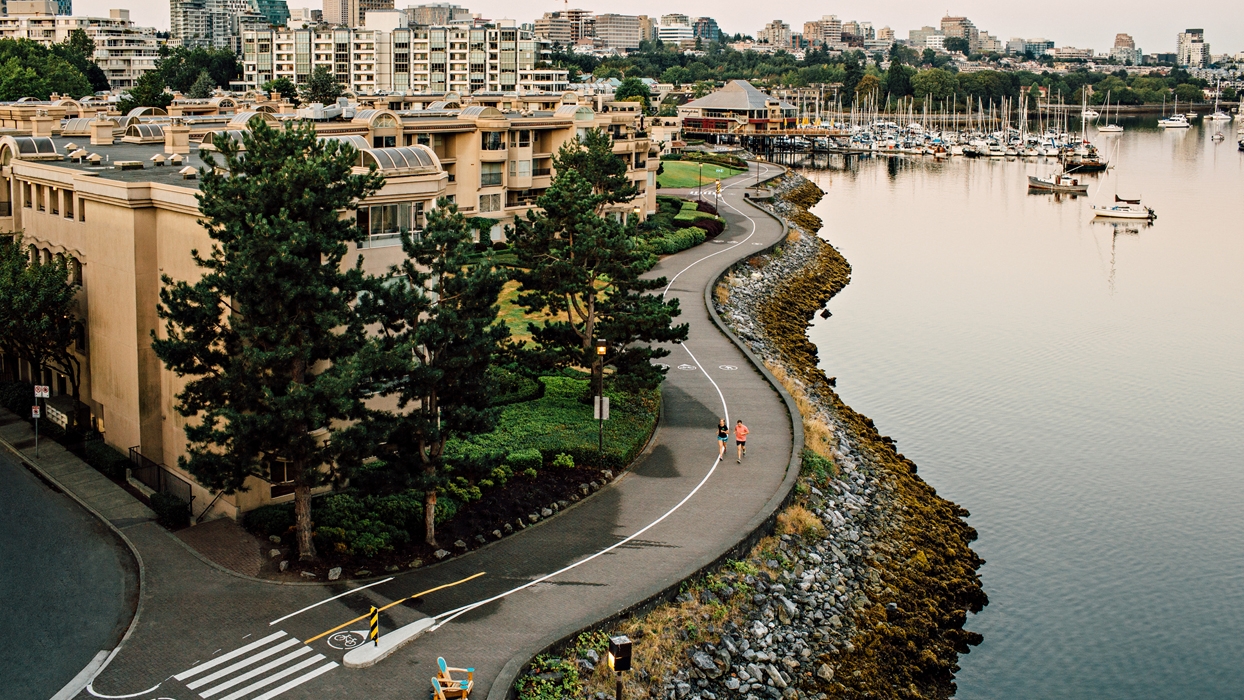 Runners on the False Creek Seawall near the Cambie Street Bridge