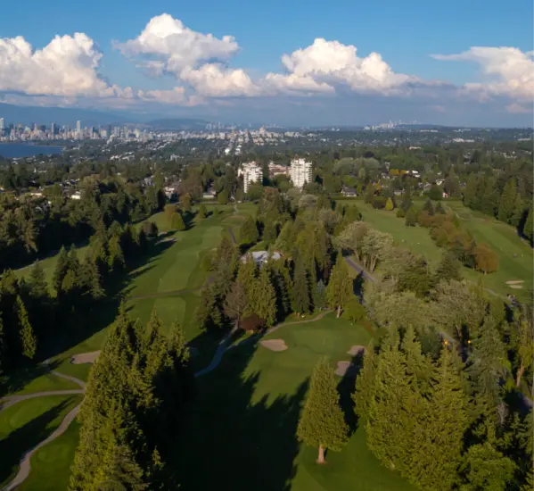 Aerial view of the University Golf Club with the city of Vancouver in the background.