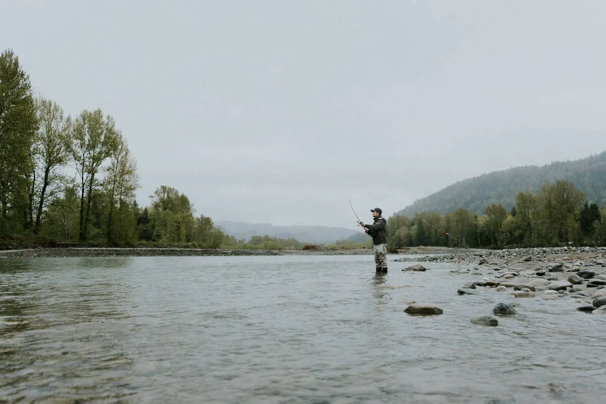 A person fishing on the Vedder River