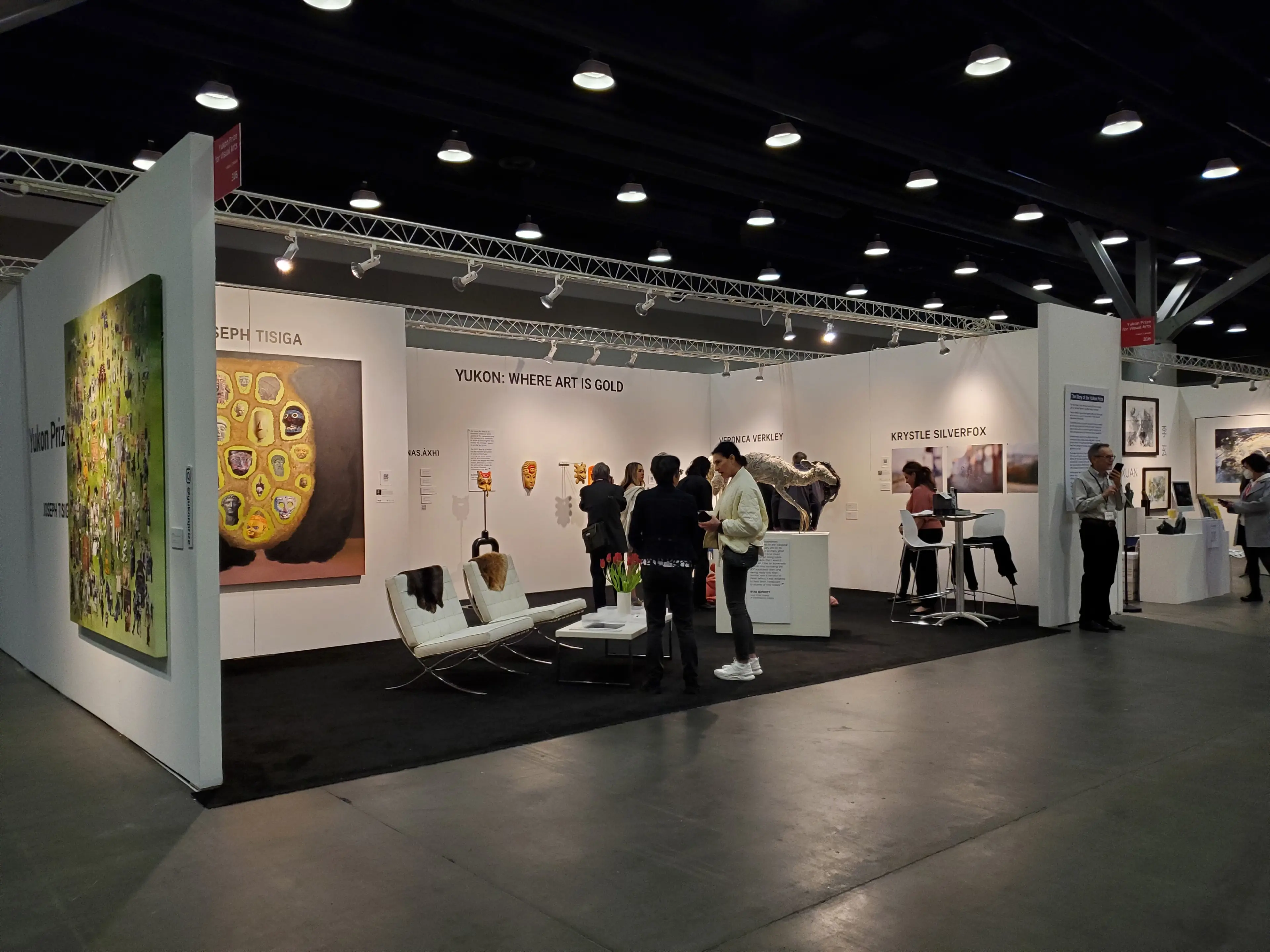 Attendees admire art exhibitors at Art Vancouver