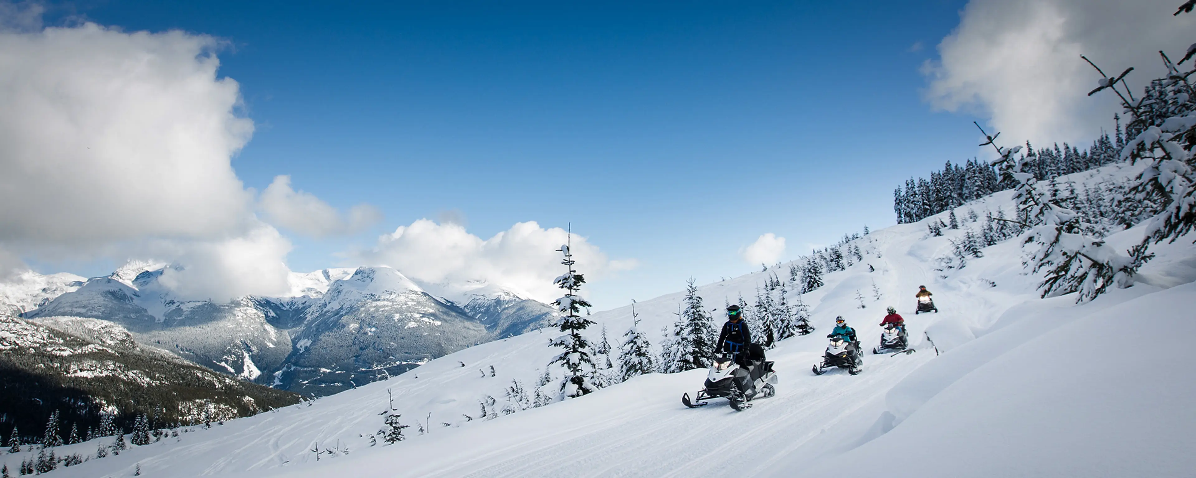 A group of snowmobiles on a tour with The Adventure Group in Whistler