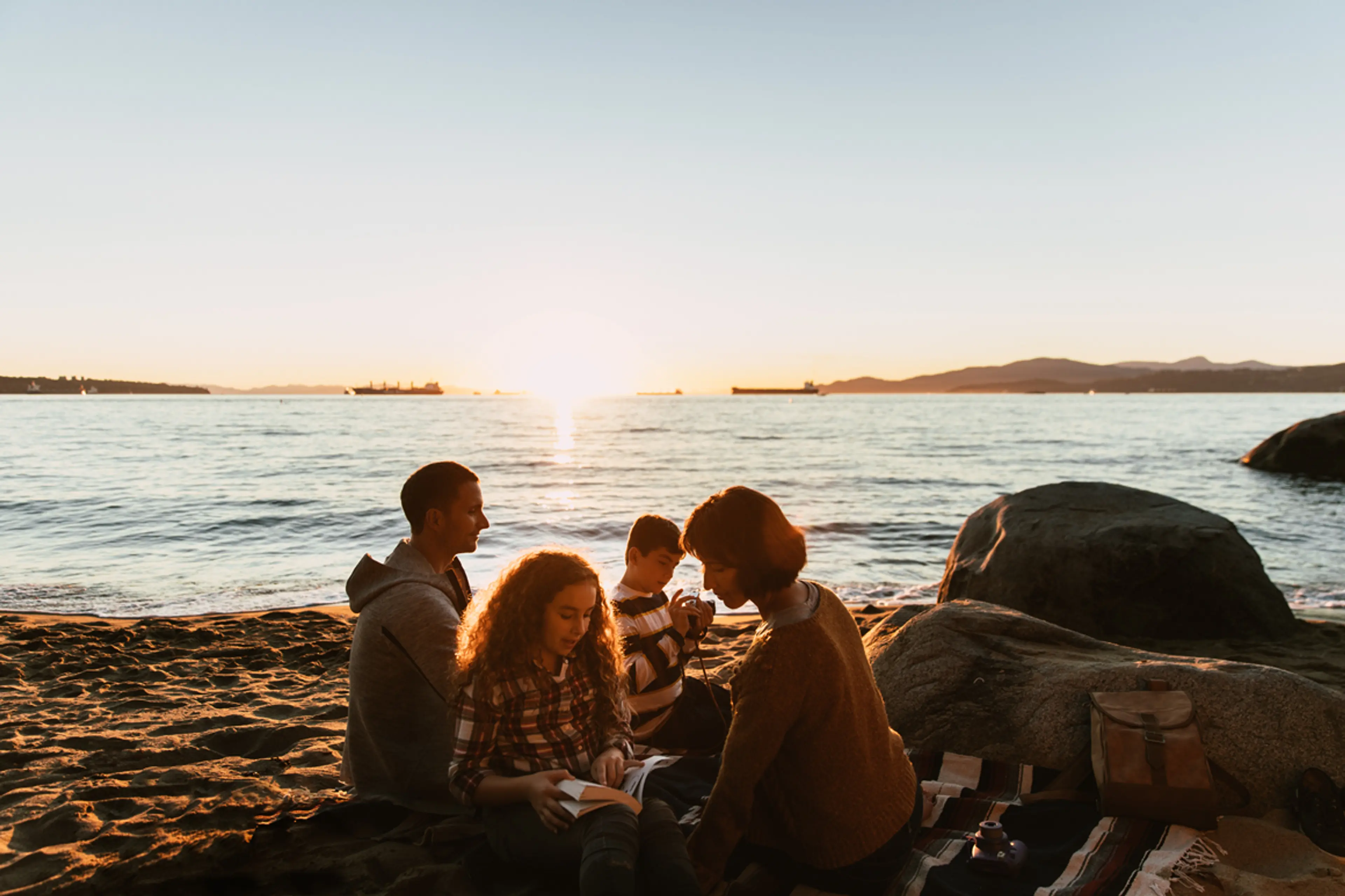 Family picnicking on the beach