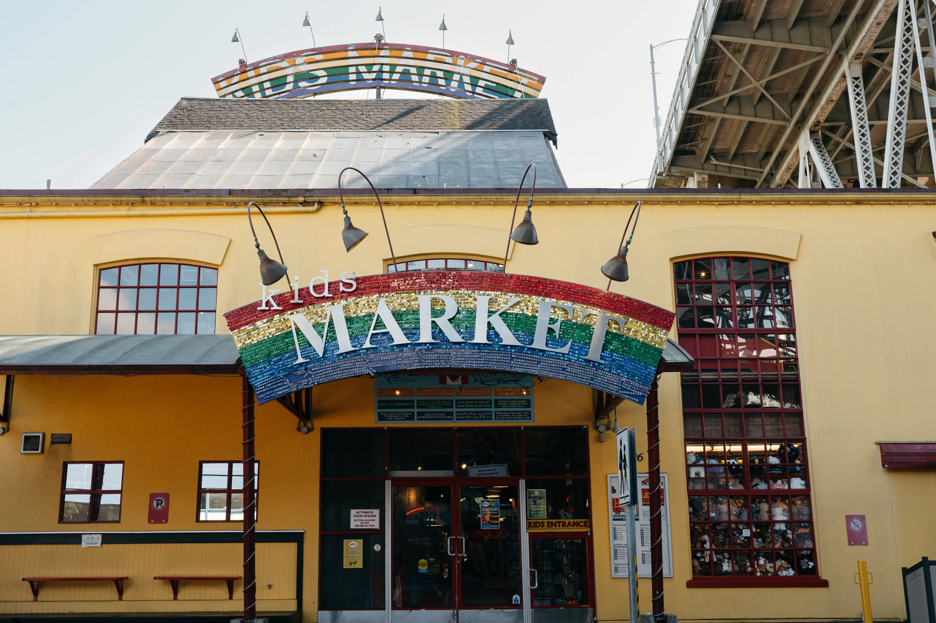 Rainbow signs on the outside of the Kids Market at Granville Island