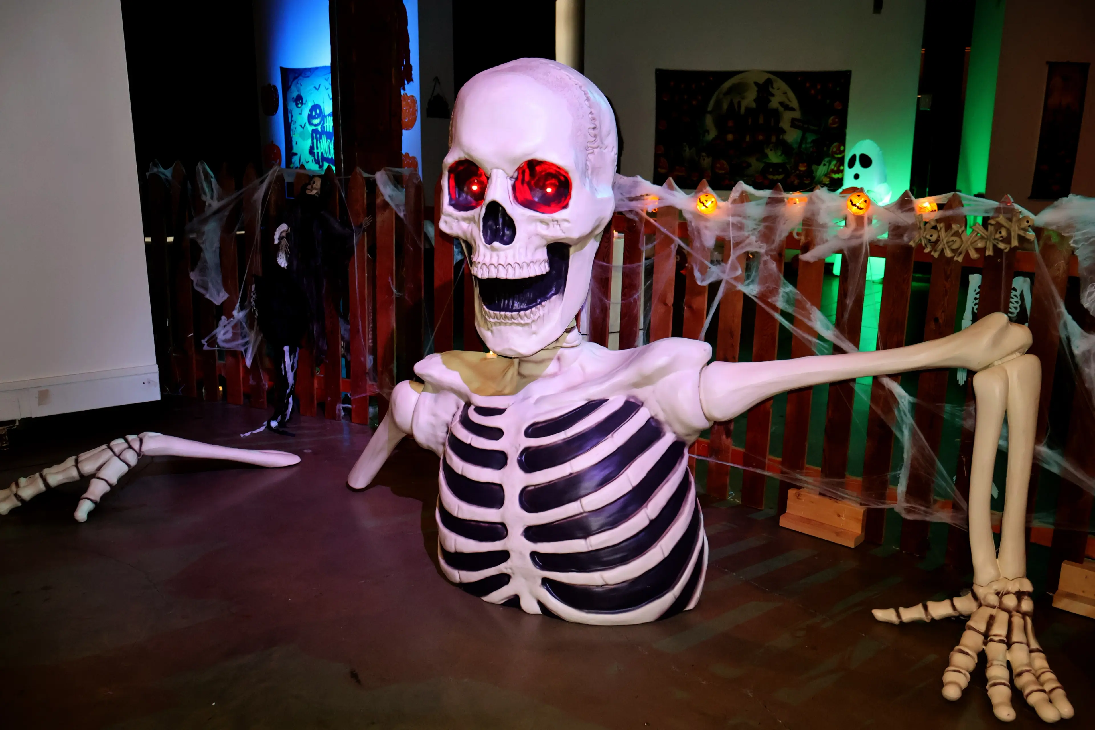 A large skeleton decoration coming out of the floor at the Halloween Haunted Walkthrough at the Roundhouse in Vancouver.