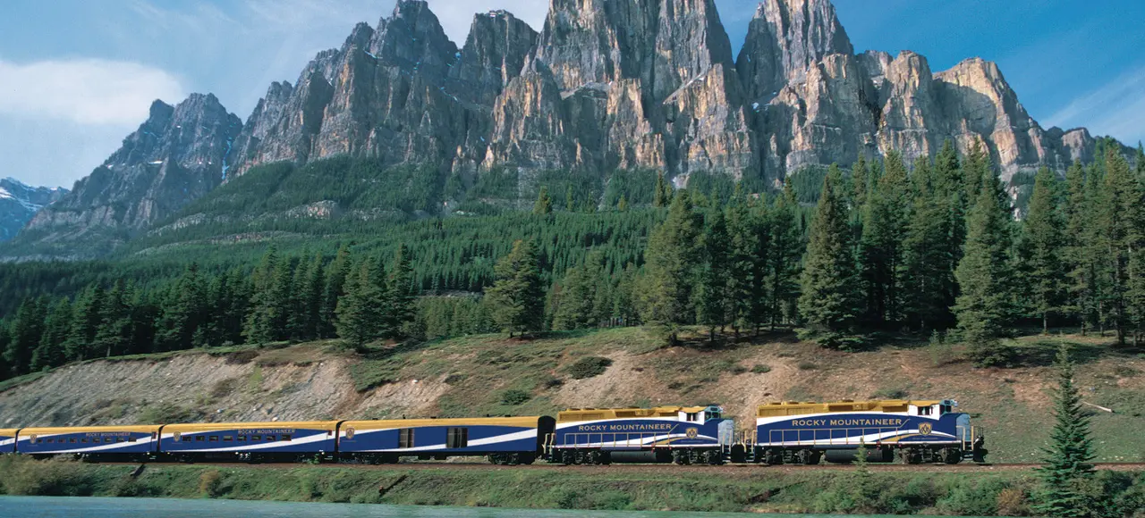 Rocky Mountaineer train travelling past Castle Mountain in Banff National Park, Alberta