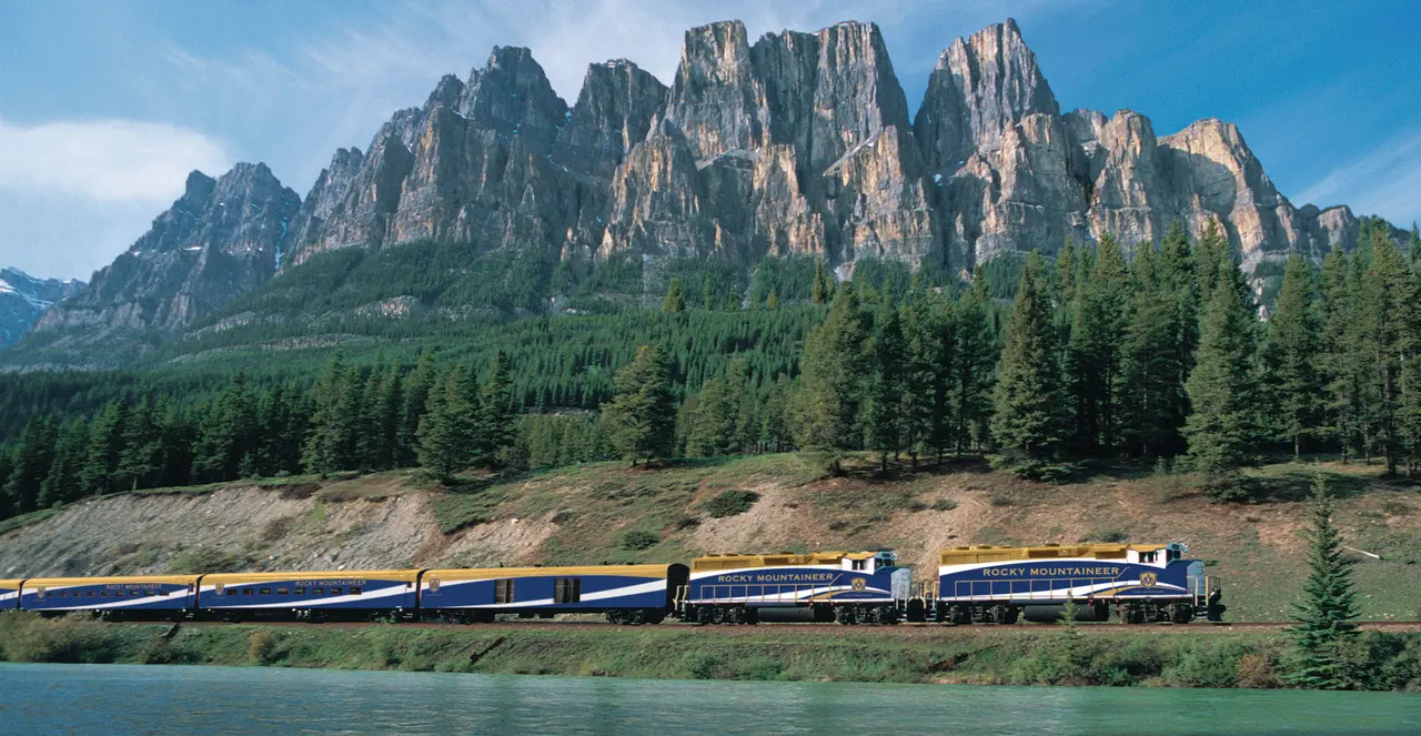 Rocky Mountaineer train travelling past Castle Mountain in Banff National Park, Alberta