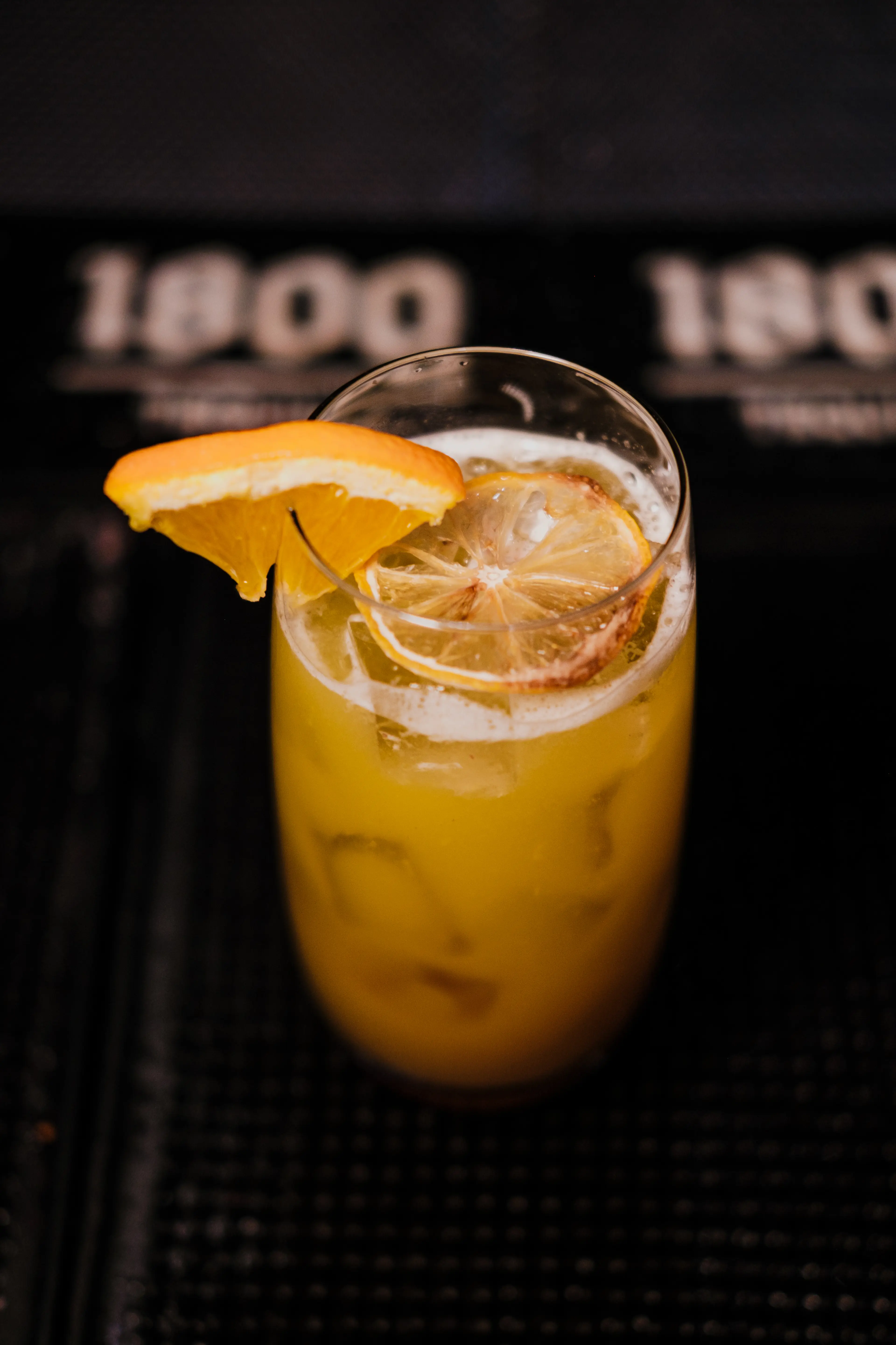 A cocktail decorated with a slice of orange at Ophelia in Vancouver