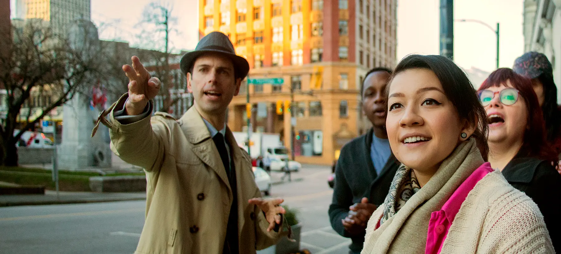 Storyteller Will pointing the way on the Forbidden Vancouver Tour
