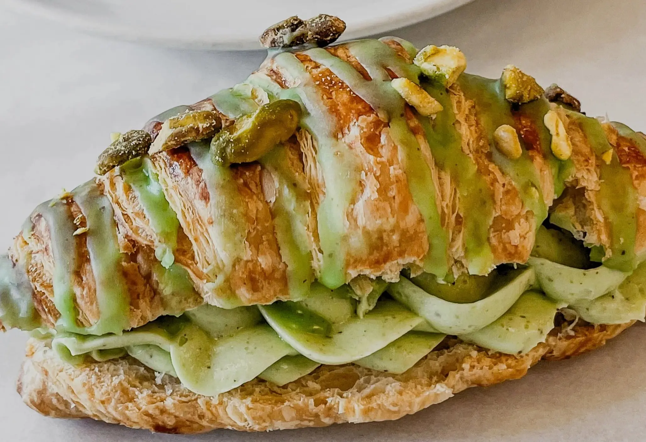 w-2499h-1406-26fa36-Crunchy+Pistachio+Cream+Croissant1