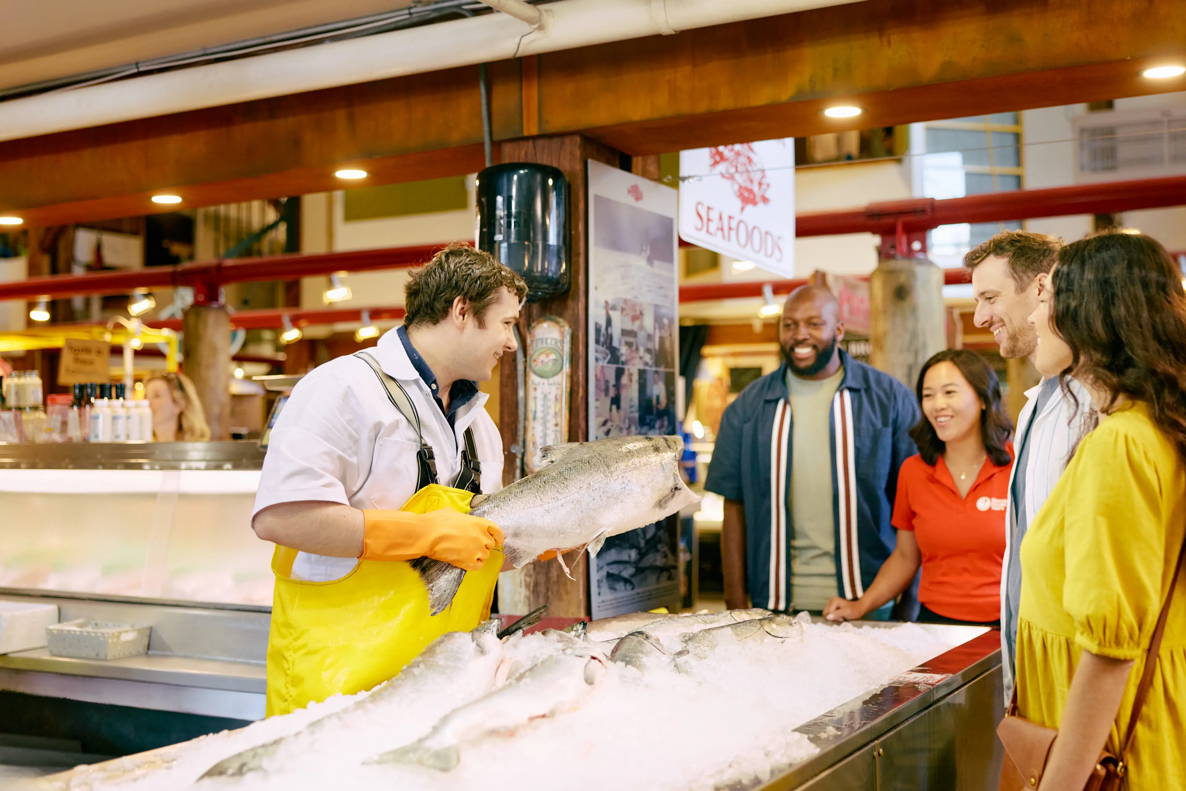 people standing at Longliner Seafoods at a Foodie Tour on Granville Island. 