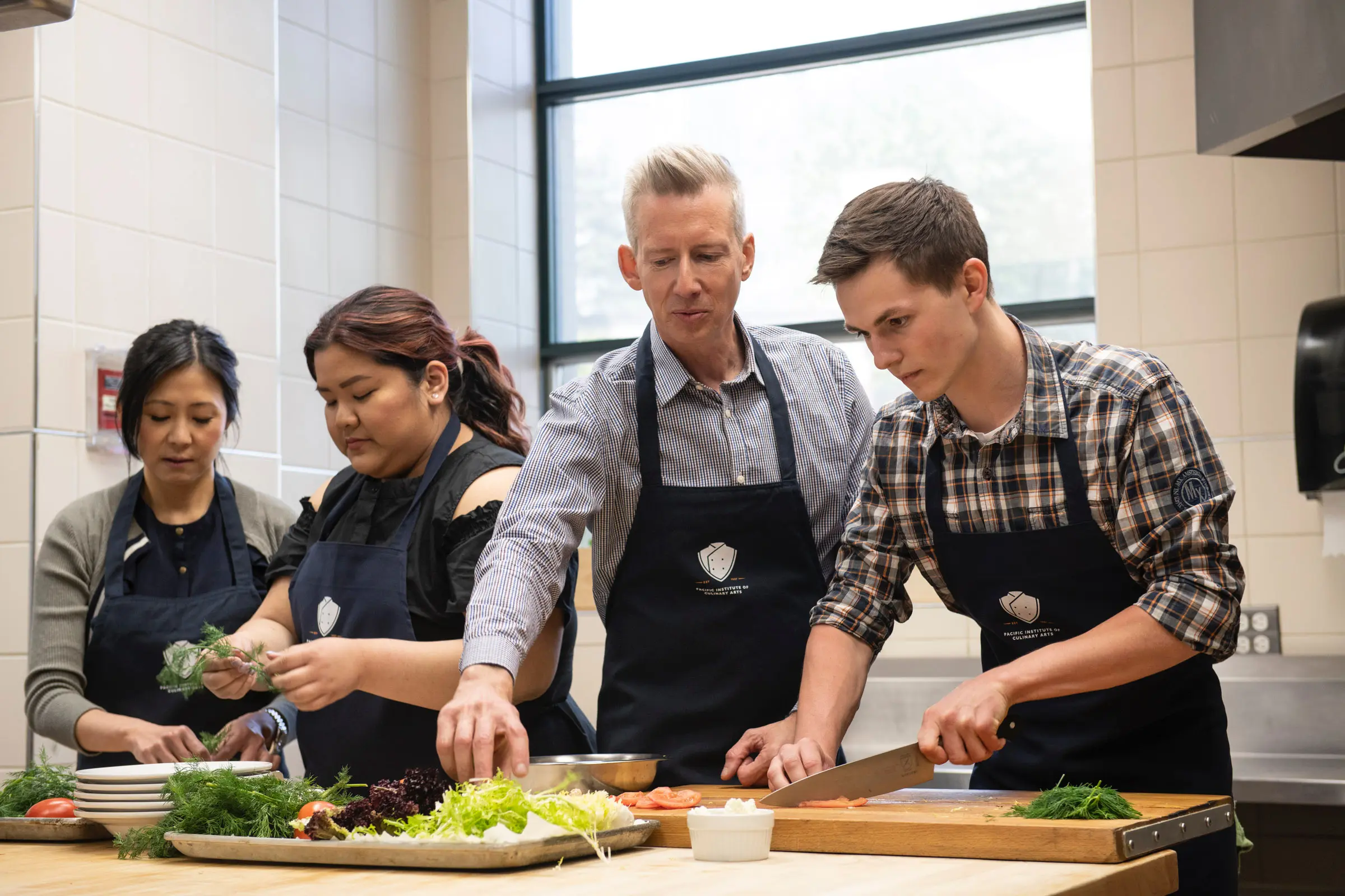 Students prep ingredients at Pacific Institute of Culinary Arts