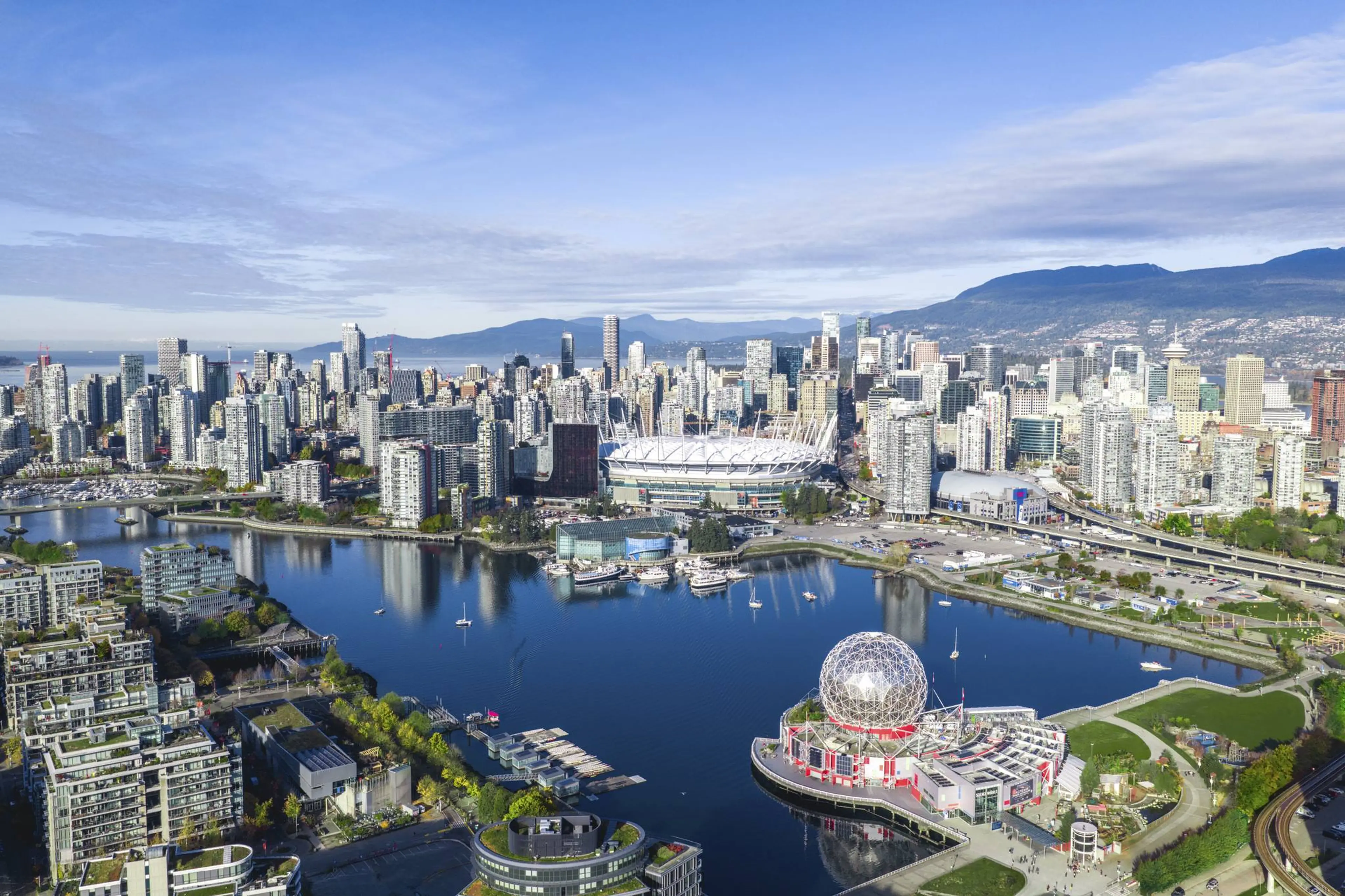 Aerial view of a city skyline of BC Place and Science World in Vancouver.