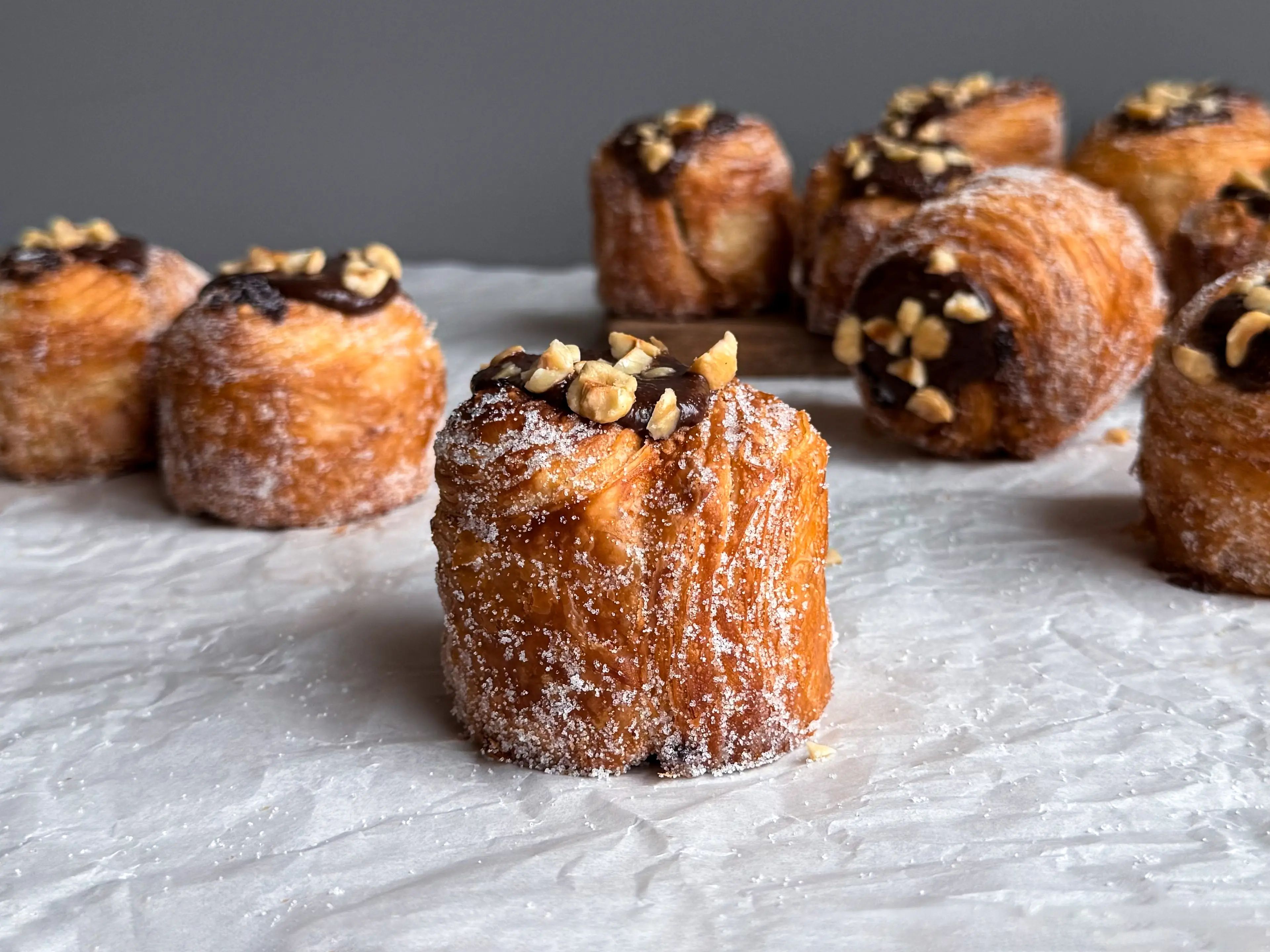 Multiple Chocolate Hazelnut Cruffins—mostly standing up, one on its side—from Terra Breads