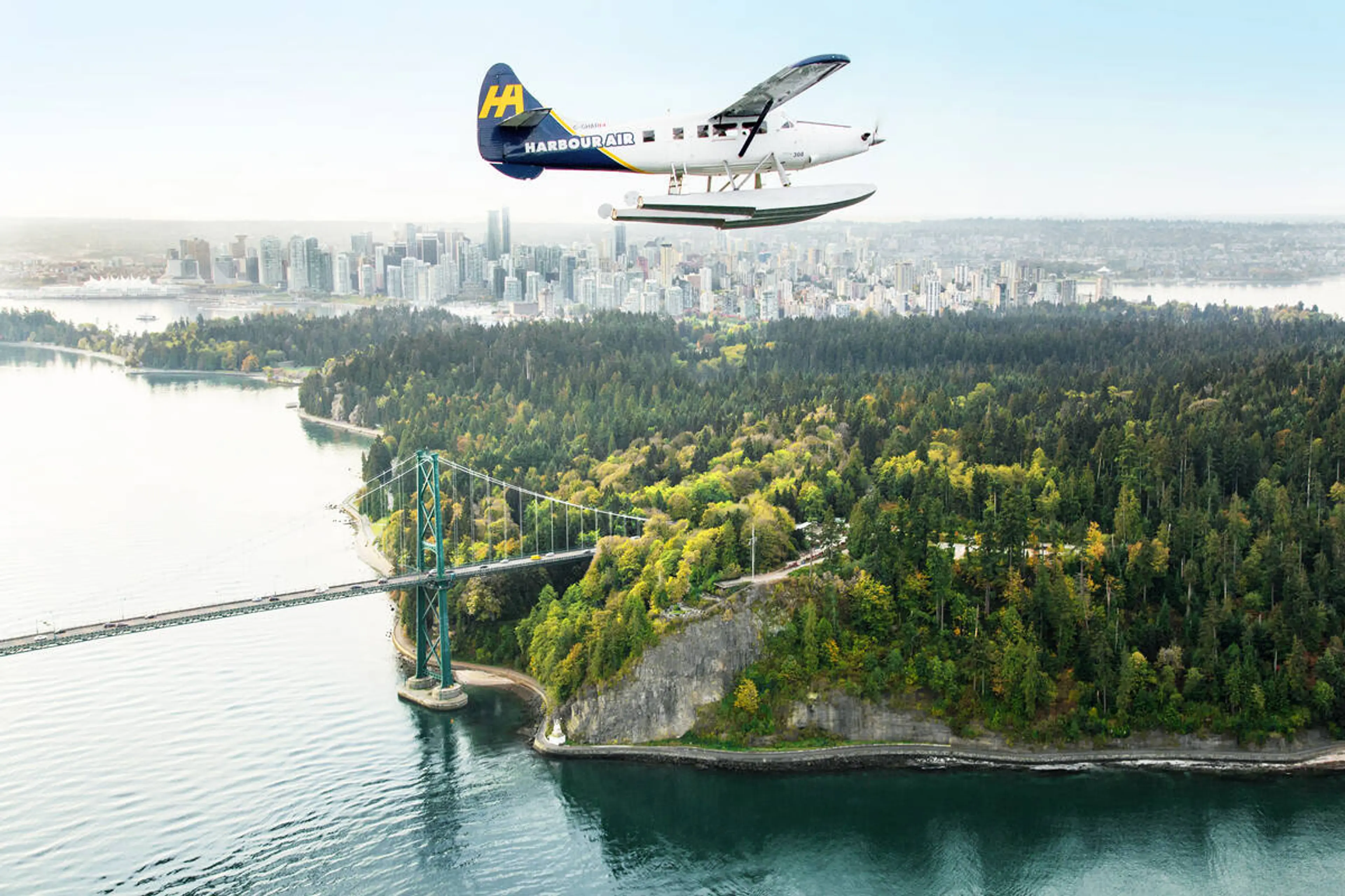A floatplane soars over Stanley Park. 