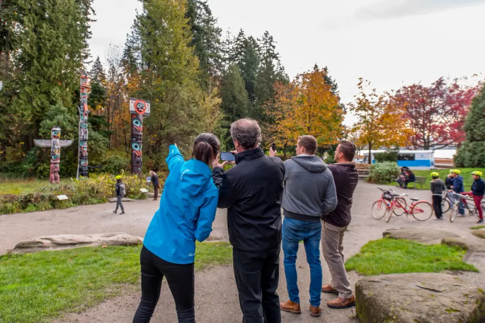 Landsea at the Stanley Park totem poles with guests