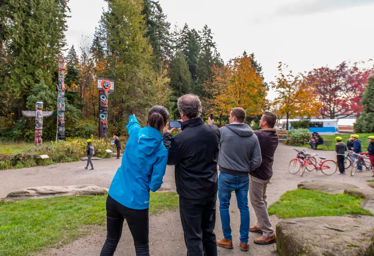 Landsea at the Stanley Park totem poles with guests