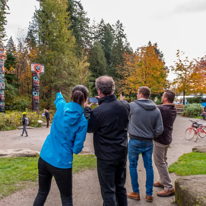Landsea at the Stanley Park totem poles with guests