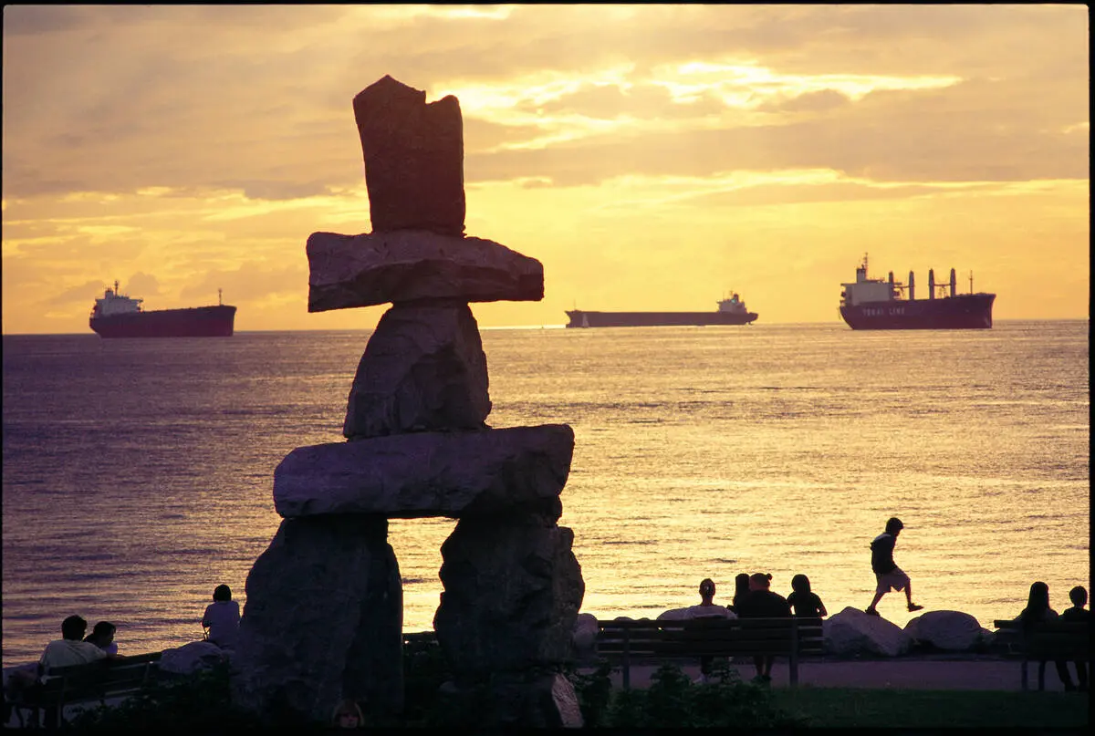 Sunset behind the Inukshuk at Sunset Beach in Vancouver