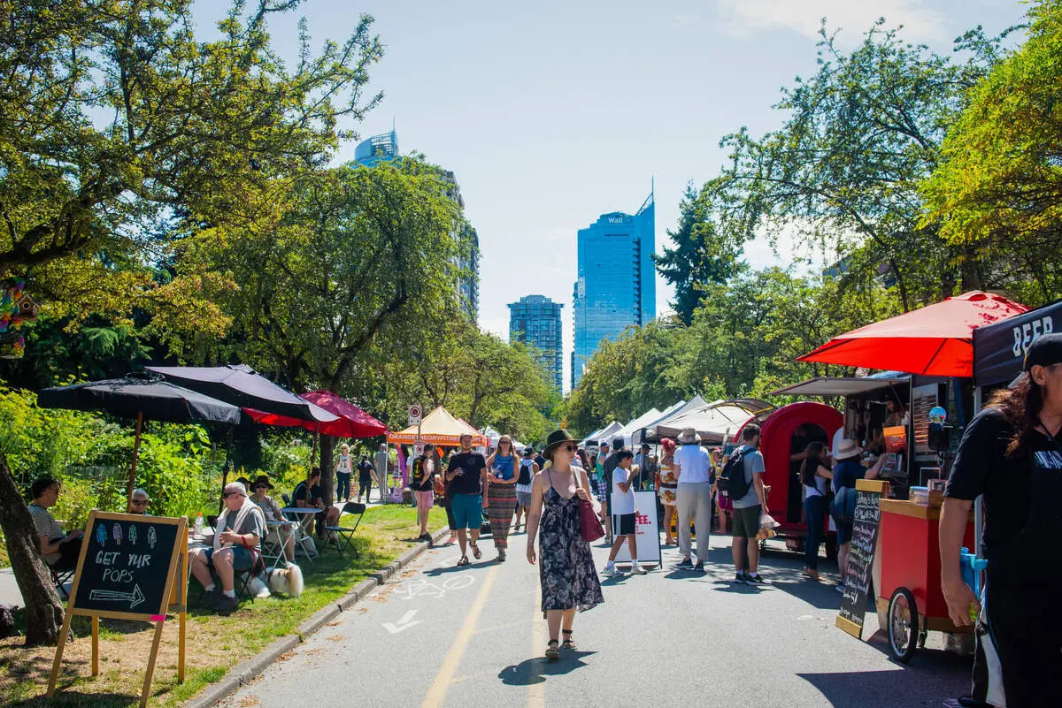 People shopping at the West End Farmers' Market.