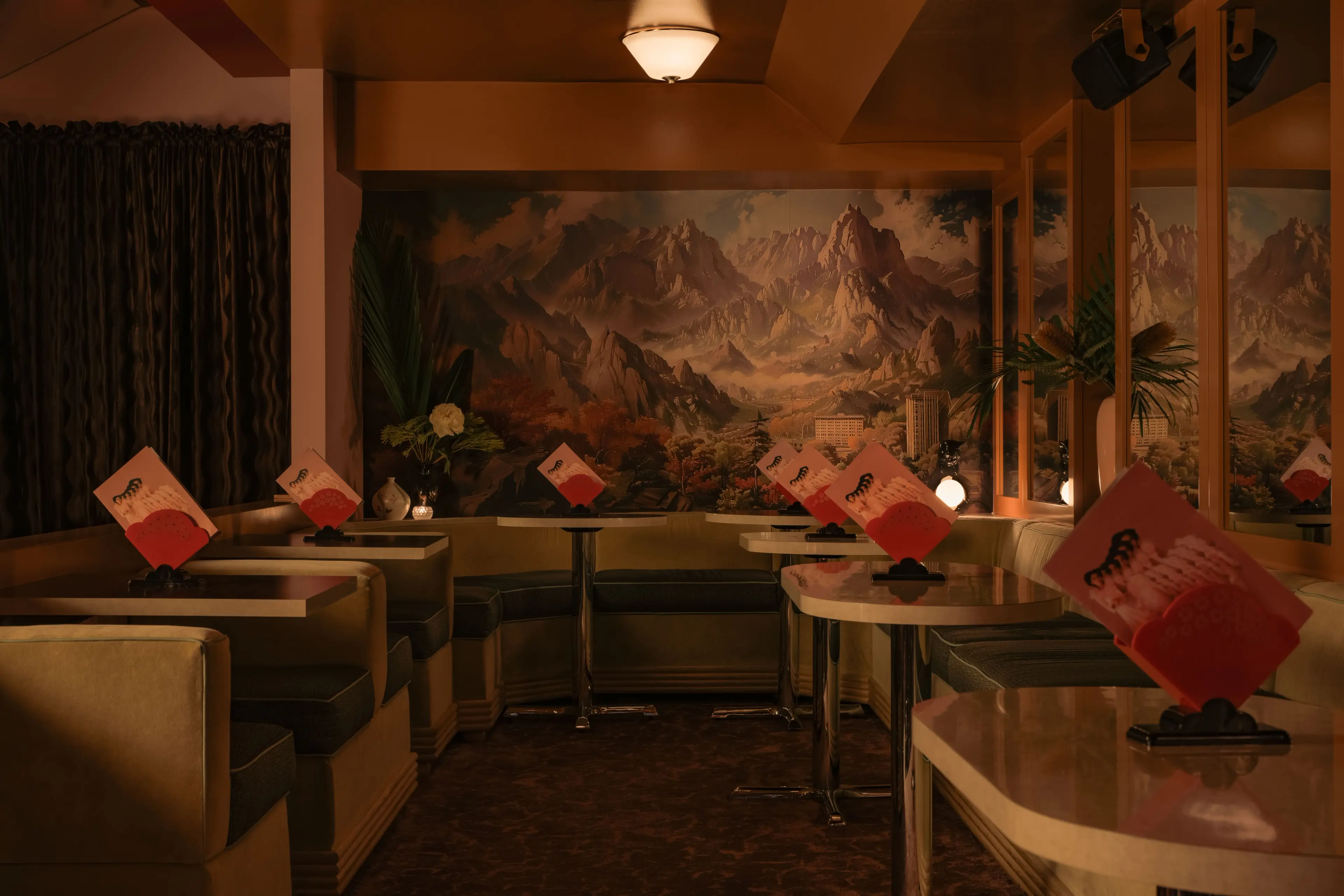 The cozy booths and retro Asian decor at Meo in Vancouver