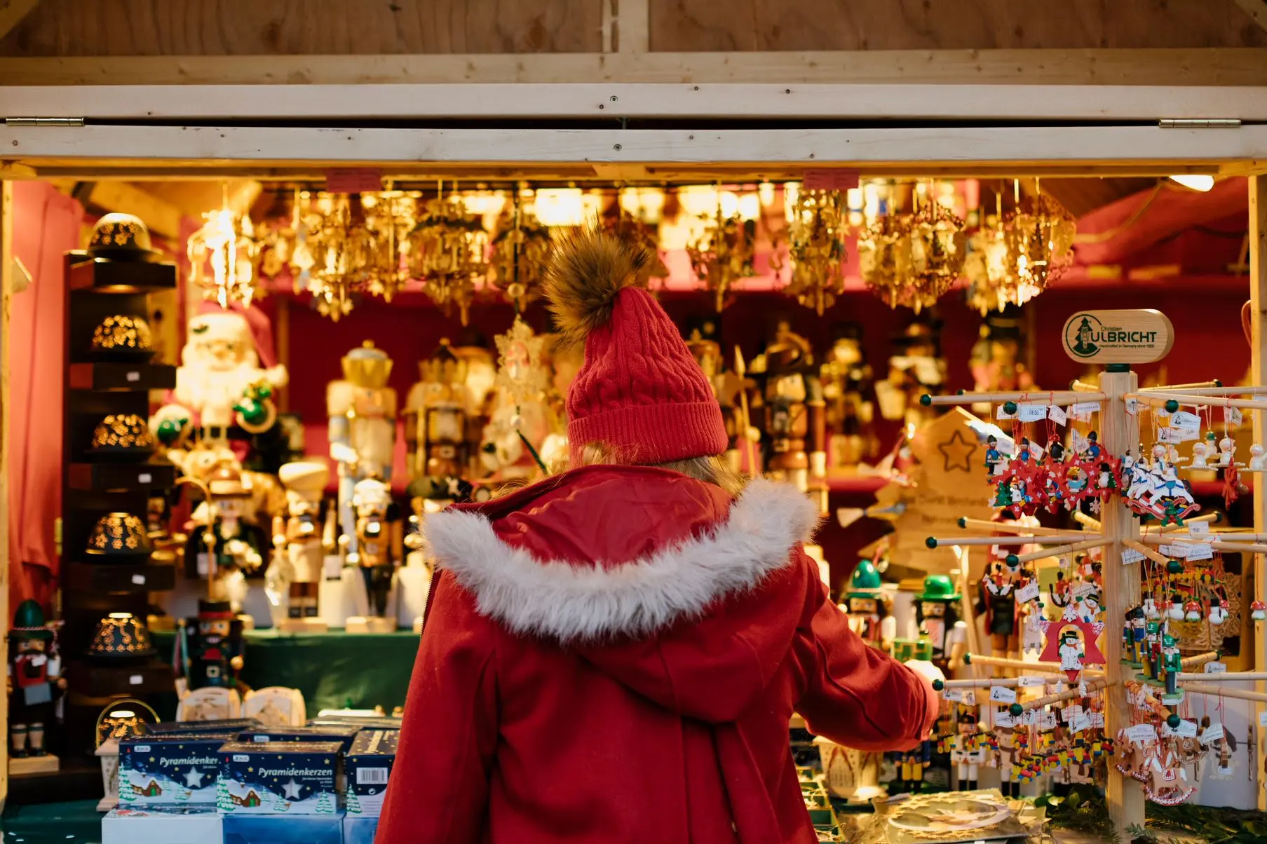 A woman looks at a display of nutrackers at the Vancouver Christmas Market