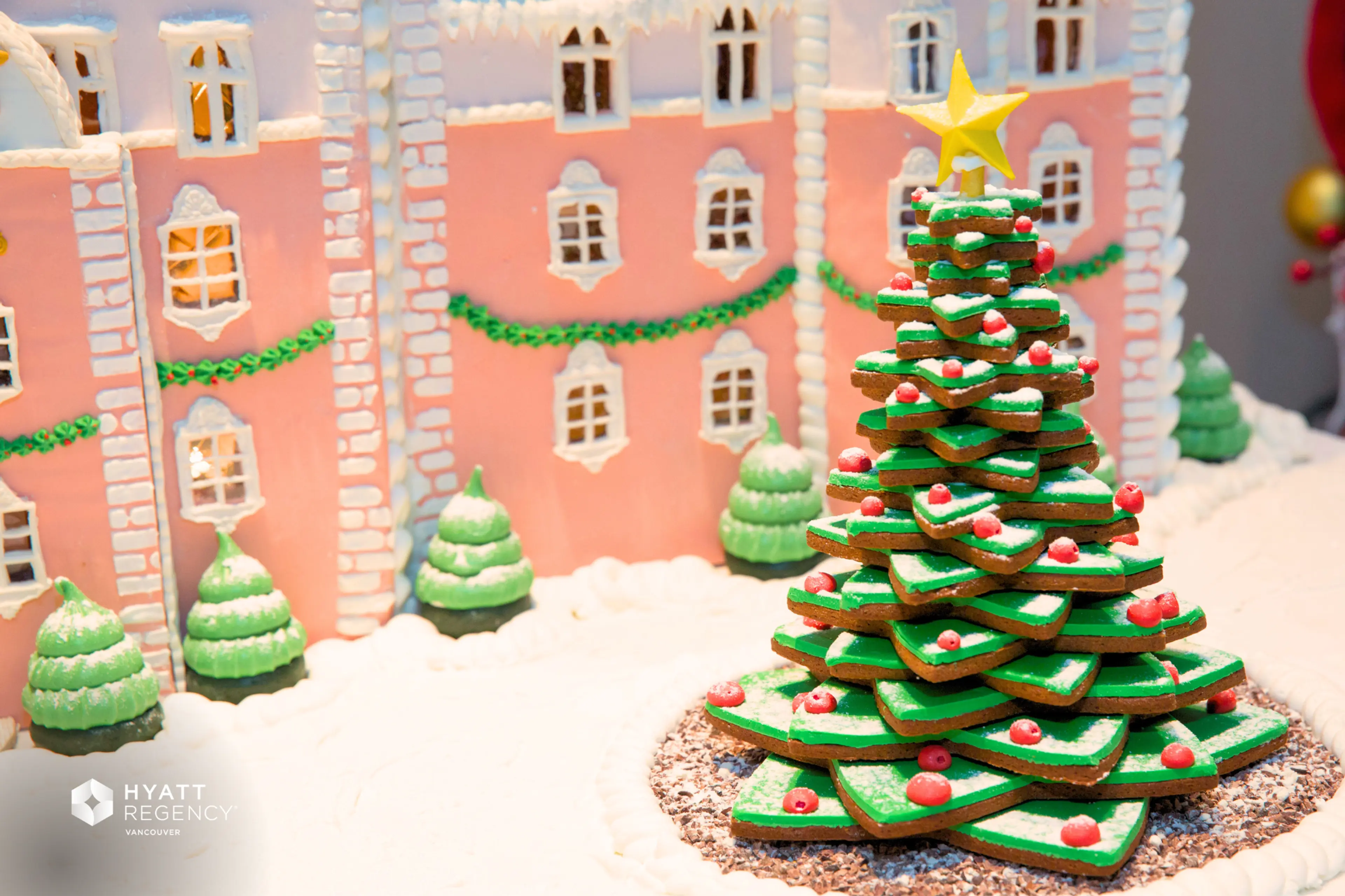 A gingerbread Christmas tree and house 