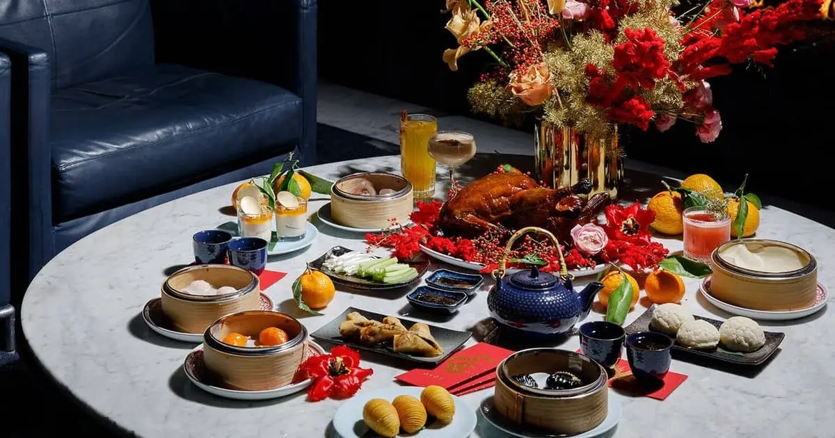 A table setting with flowers tea and dumplings
