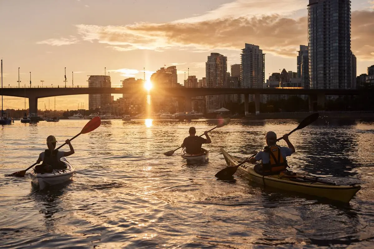 Kayakers on False Creek at sunset.